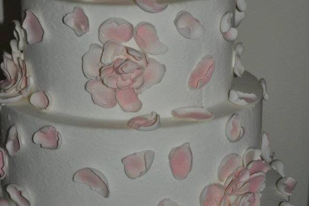 Wedding cake with pink petals