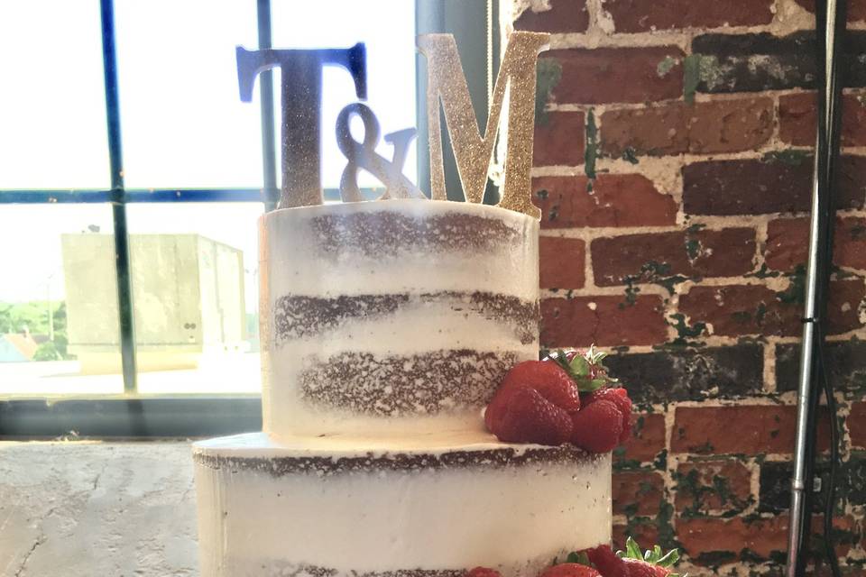 Cream and gold monogrammed cake