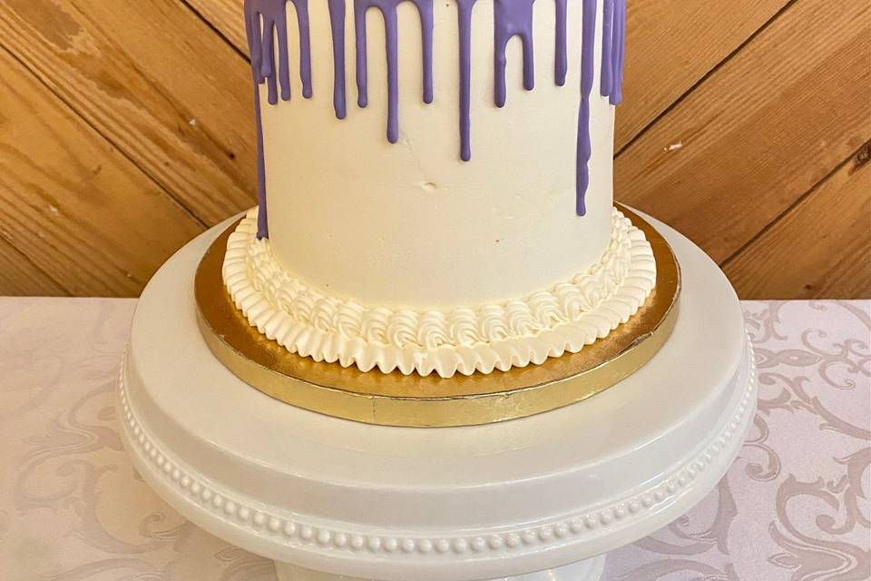 Purple drip cutting cake