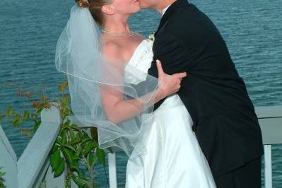 Bride and Groom on platform overlooking the beach.