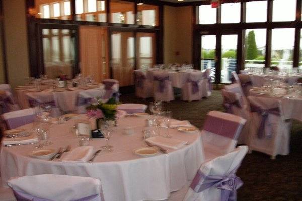 Chair covers and purple sashes.  November reception in the Bay & Cliff Room.  Maximum 225 guests.