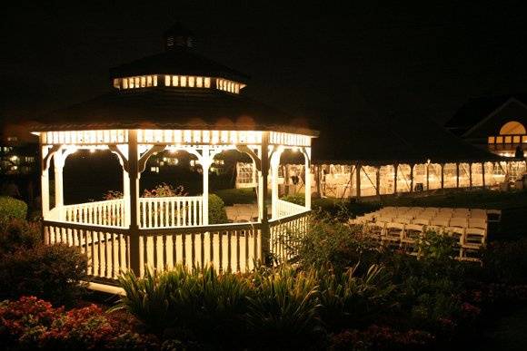 Gazebo at night with Tent in the background.