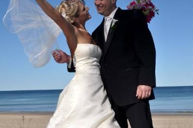 Bride and Groom on platform overlooking the beach.