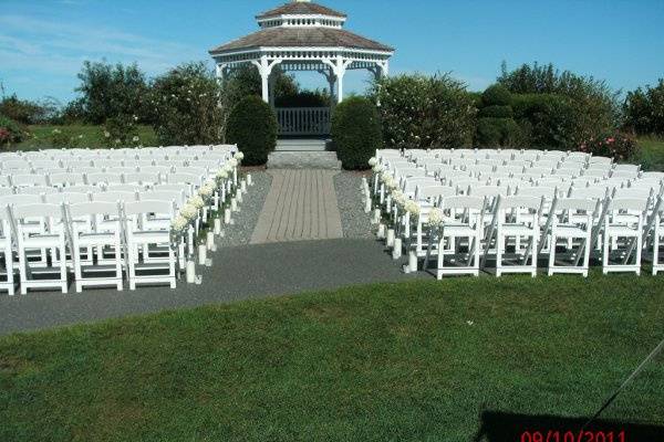 Gazebo set for a ceremny.  Maxiumum of 180 chairs for ceremony with additional standing room.Cape Cod Bay is in the background!