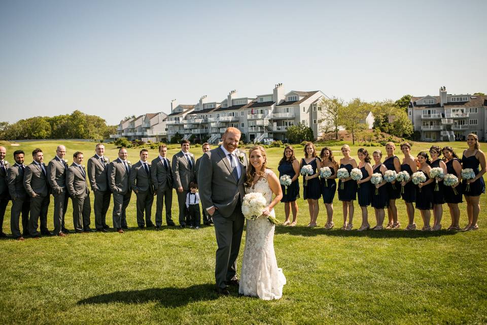 The couple with the bridesmaids and groomsmen