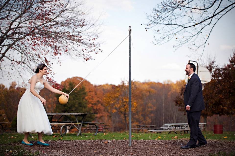 Newlyweds playing tetherball