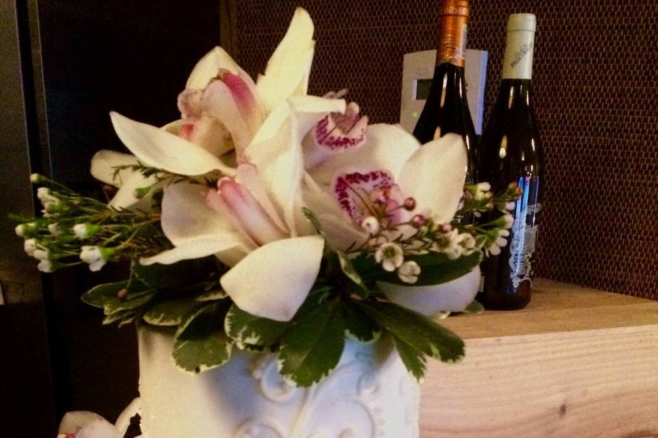 Two tier cake with flowers on top