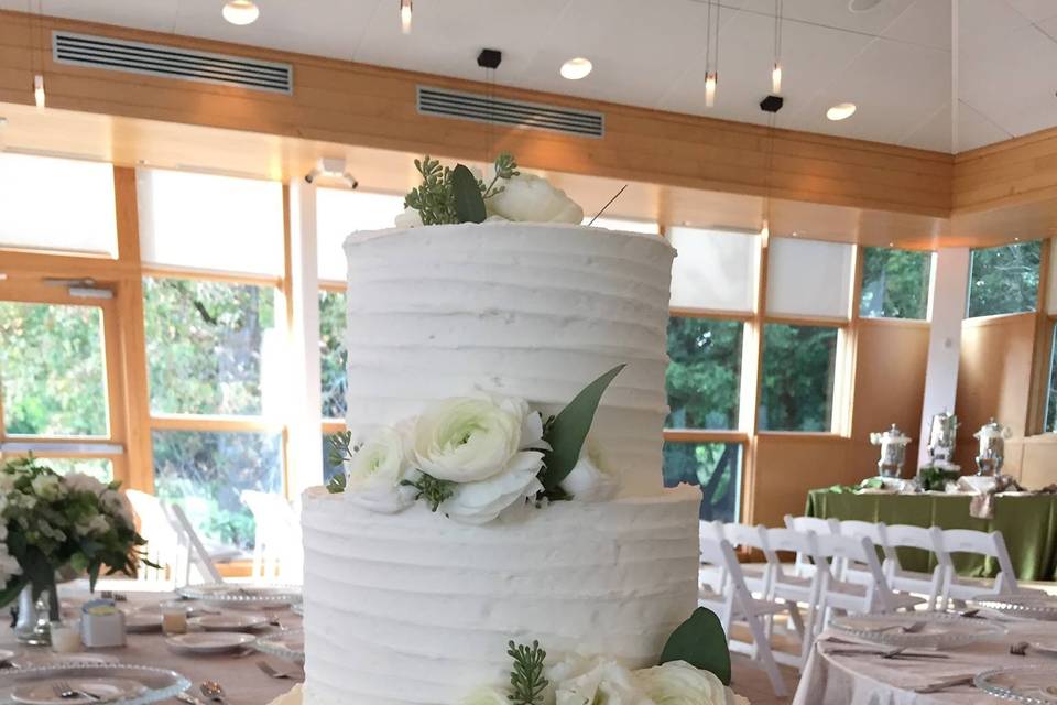 Four tier wedding cake with white flowers