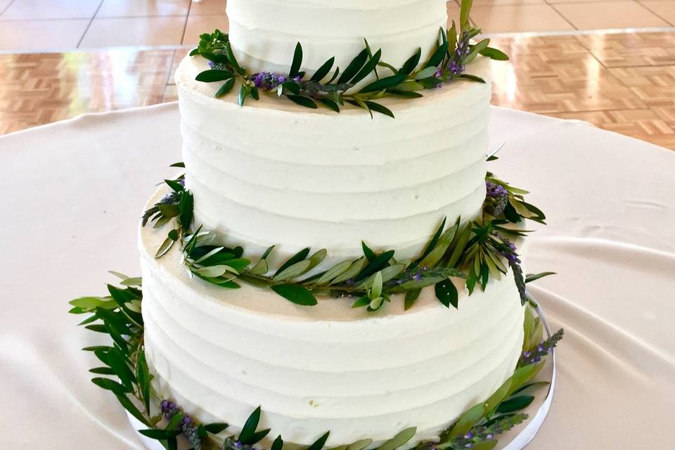 Three tier wedding cake with grass