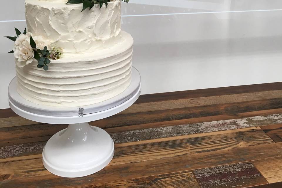 Three tier cake with pink flowers