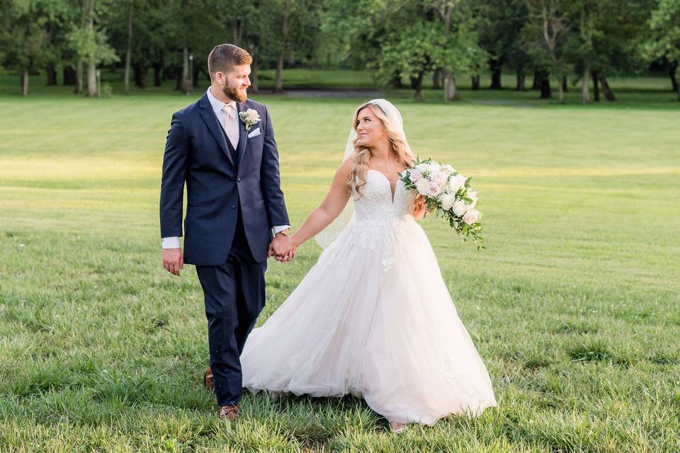 Couple in meadow.