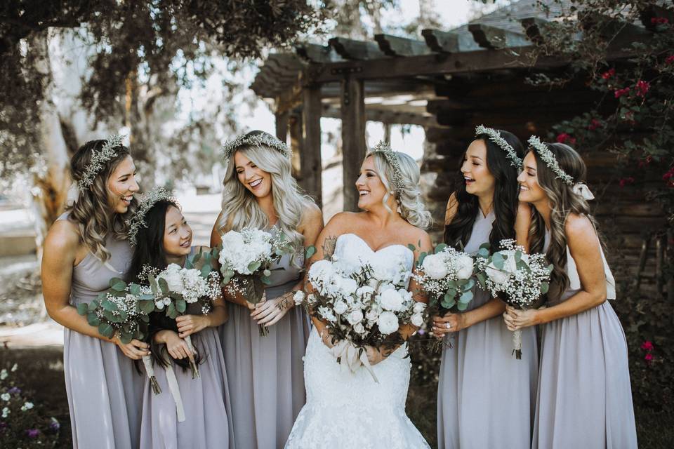 Bride and bridesmaids share laughs