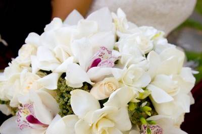 Bride's bouquet of gardenias, orchids, freesia, and roses. Photo: Tana Photography