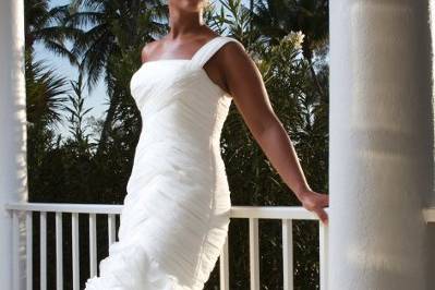 Bride posing beside the railing