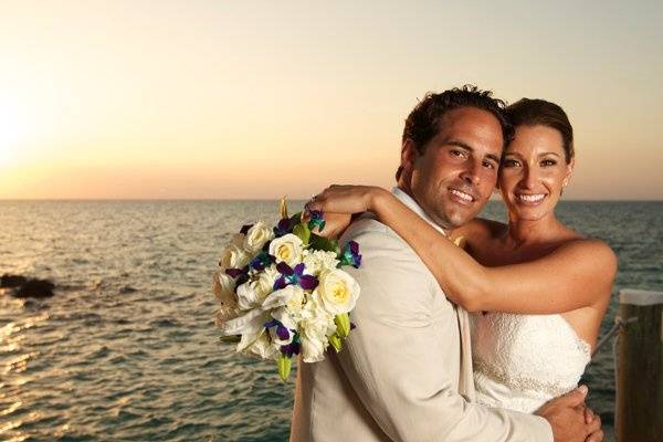 Couple posing beside the sea