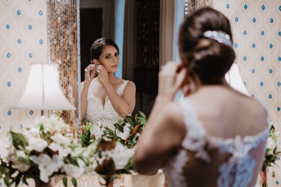 Bride clipping on earrings