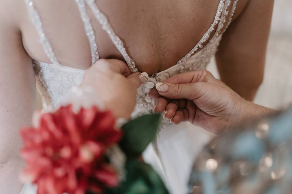 Buttoning the dress