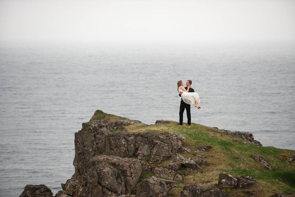 Bride and groom by the ocean