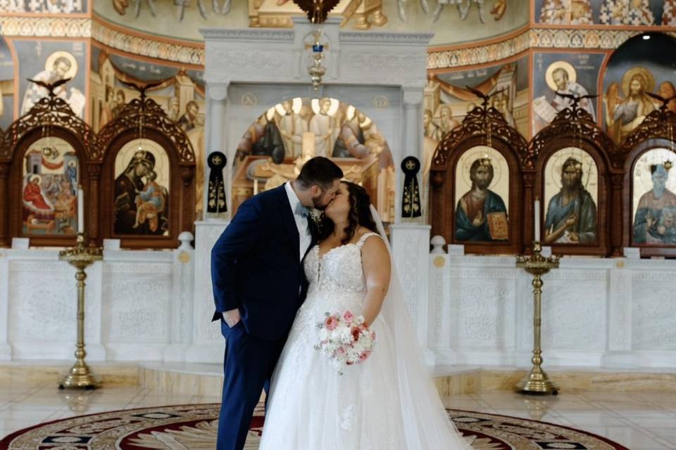 A kiss between the newlyweds