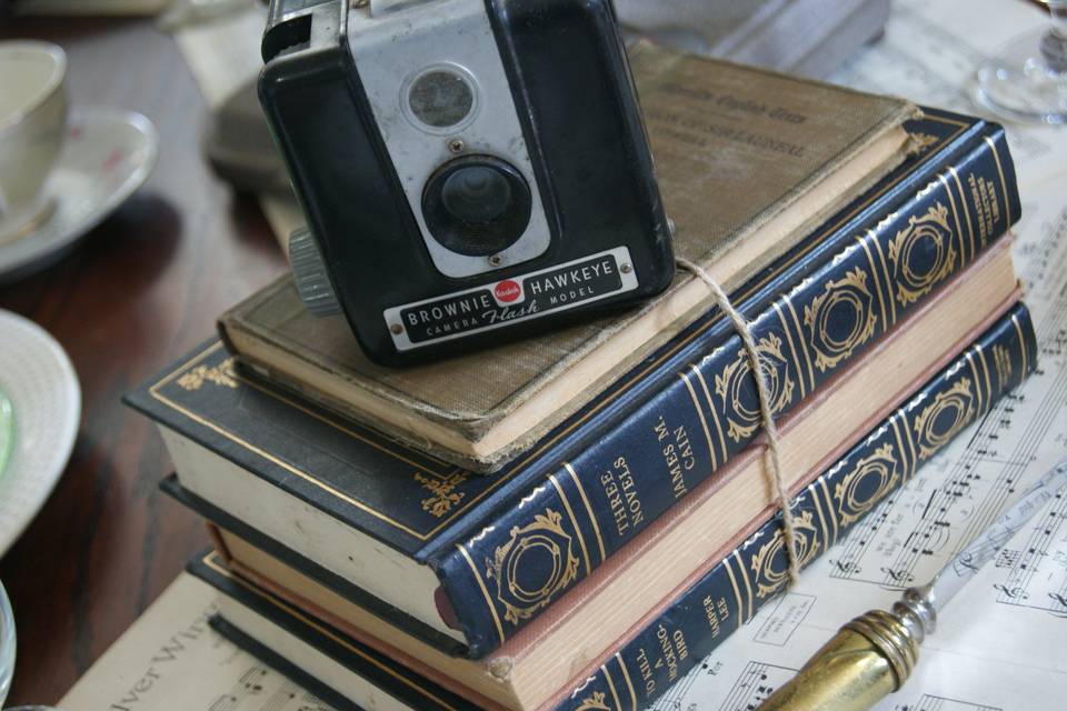 tabletop decor- old books, sheet music, vintage china, and cameras