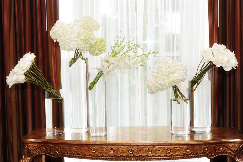 glass cylinder vases with grouping of white floral for a modern elegant wedding at the Skirvin Hotel