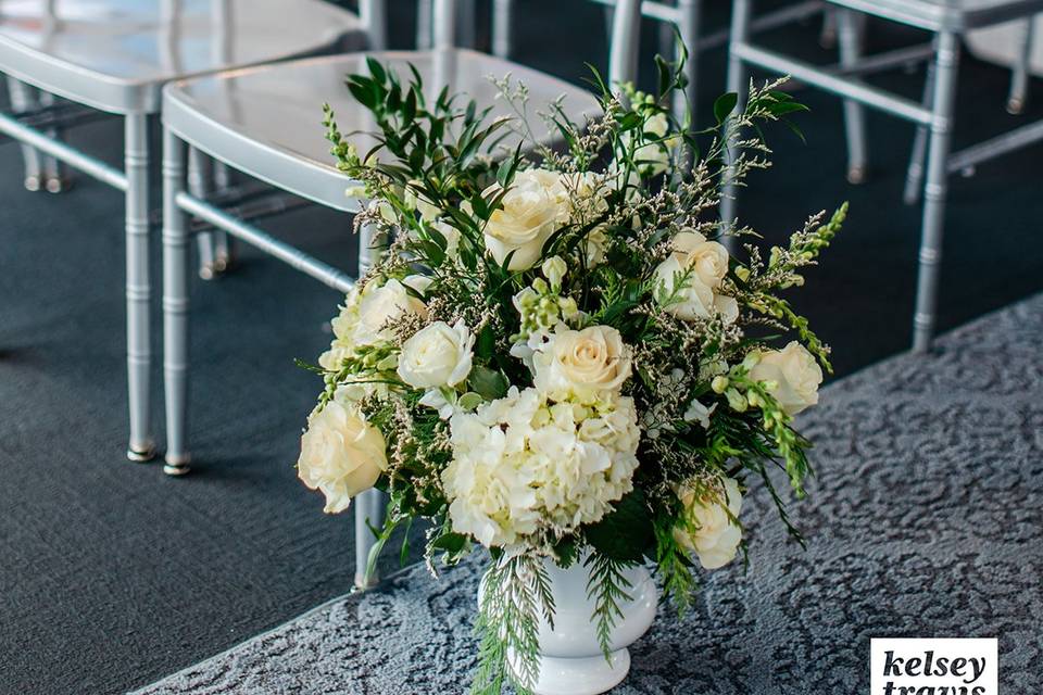 White & green aisle florals