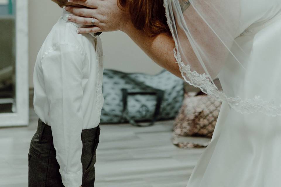Bride kissing ring bearer