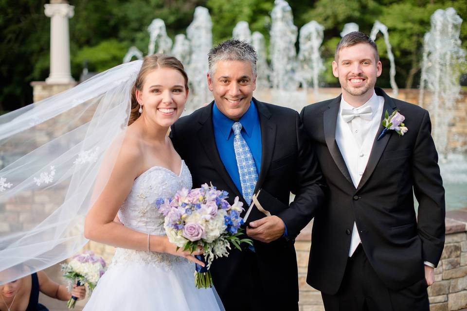 Newlyweds and officiant