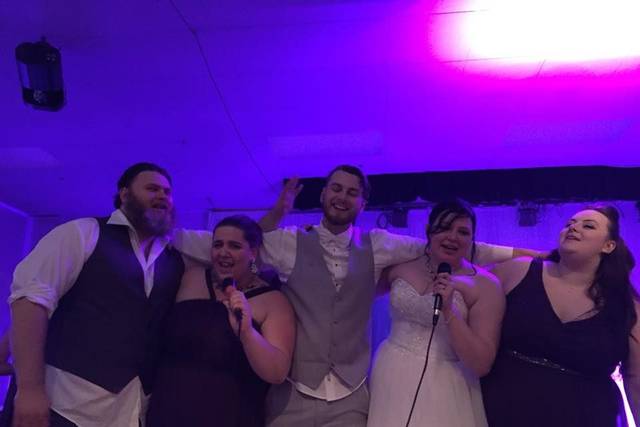 The couple with the bridesmaids and groomsmen