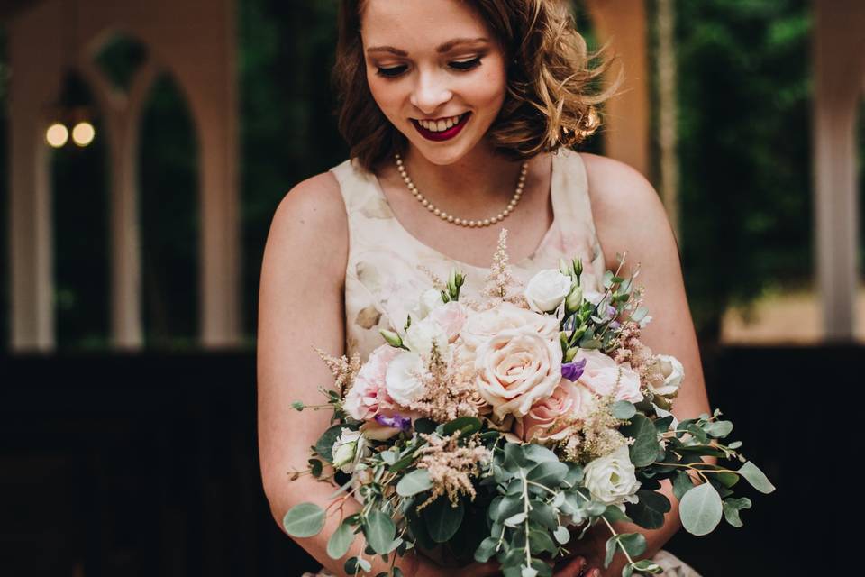 Happy bride with bouquet