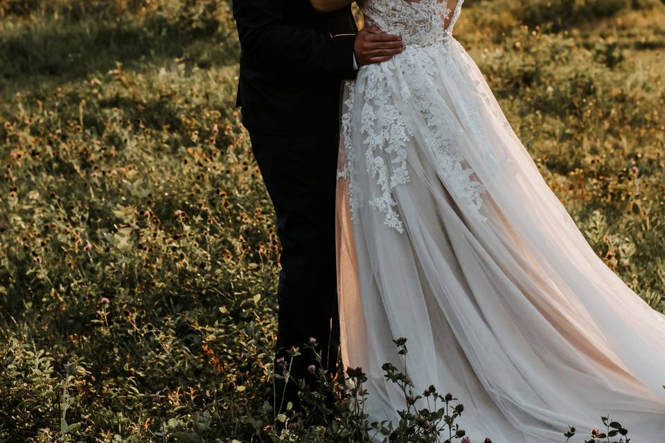 Couple embracing in field