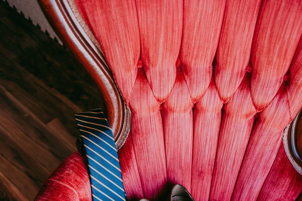 Wedding attire in red chair