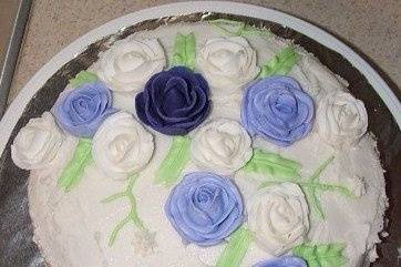 This was one of my first cakes. The flowers are handmade out of buttercream. The cake is white, flavored butterrum.