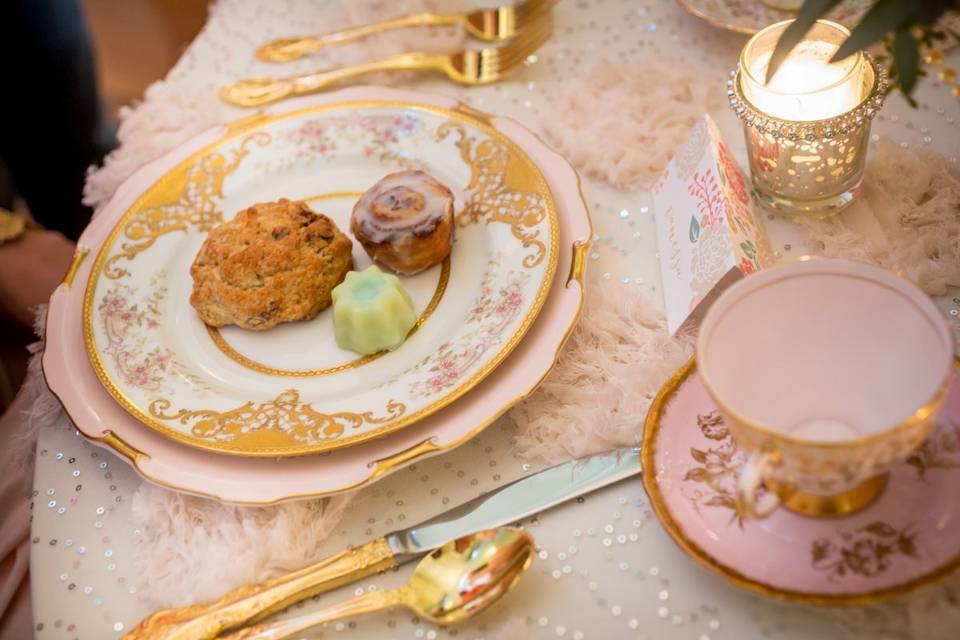 Pink and Gold place setting with delicious afternoon tea