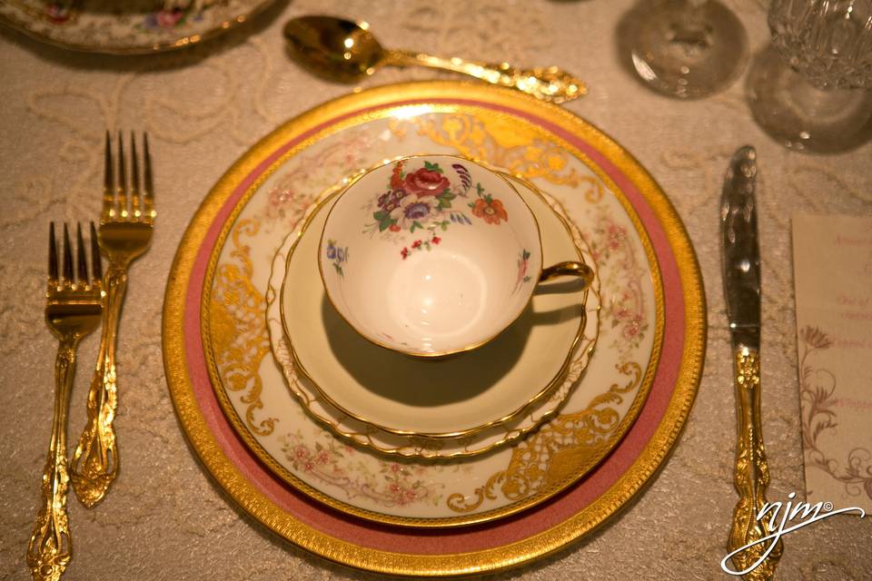 Closeup of place settings glowing in the light