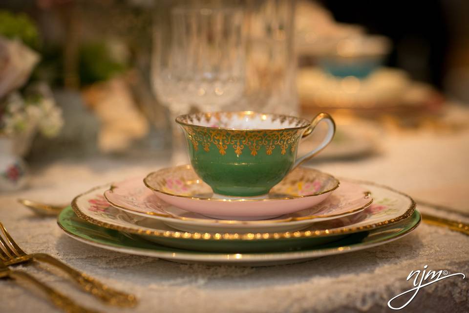 Elegant green and pink place setting adding style and charm to the tablescape