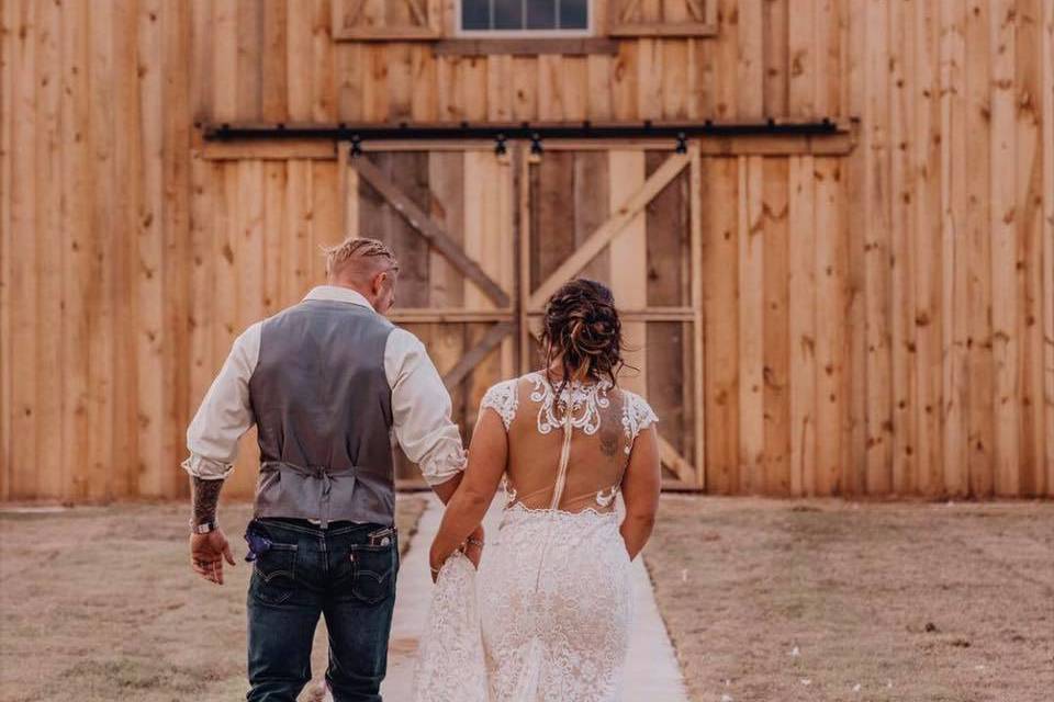 Bride and groom at rustic rose