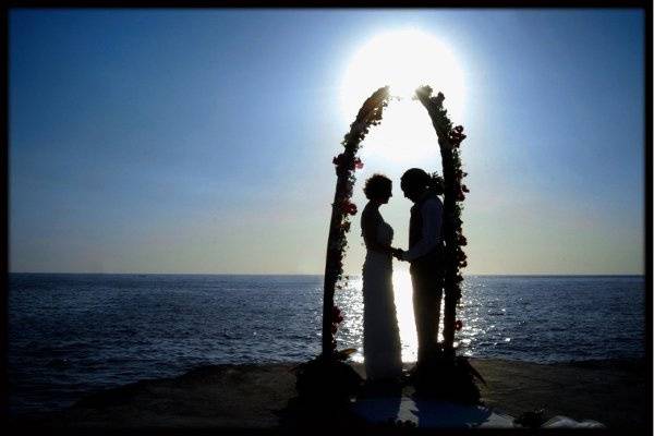 Jamaican wedding vows at sunset.