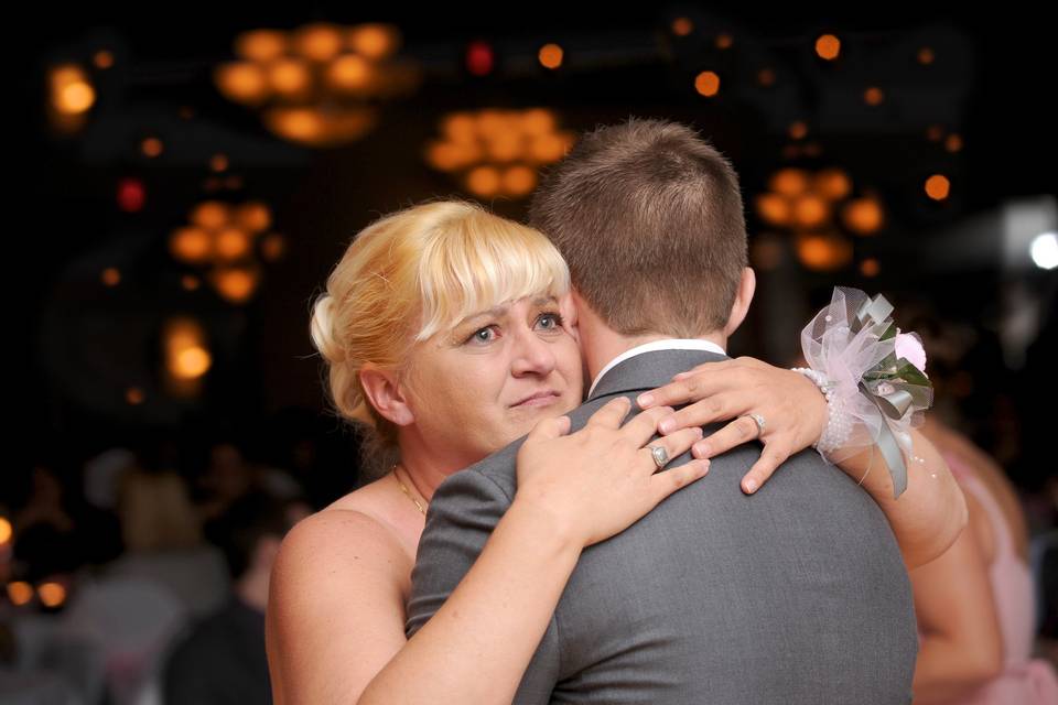 Mother of the groom starts to cry during the mother/son dance at the Woodlands of Van Buren Golf Club in Detroit, Michigan.