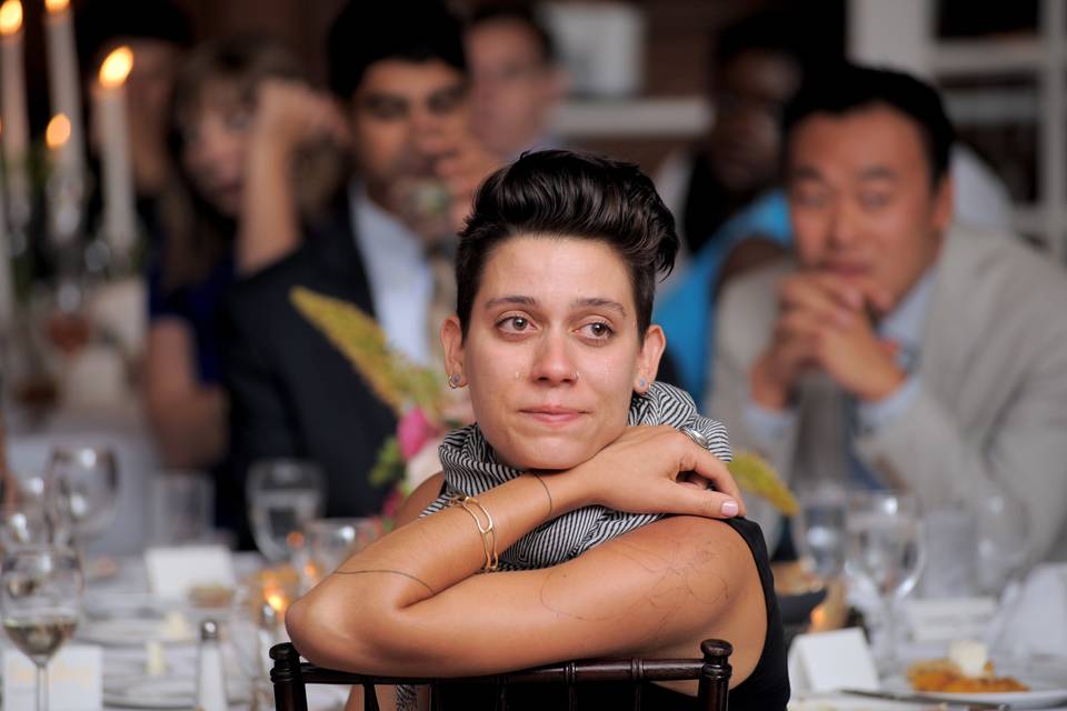 A wedding guest starts to cry during the formal dances at a Country Club in Dearborn, Michigan.