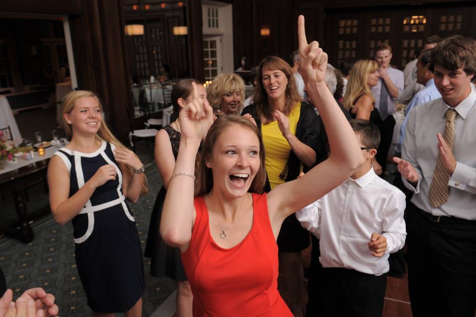 An enthusiastic dancer boogies on down during a Dearborn, Michigan wedding.