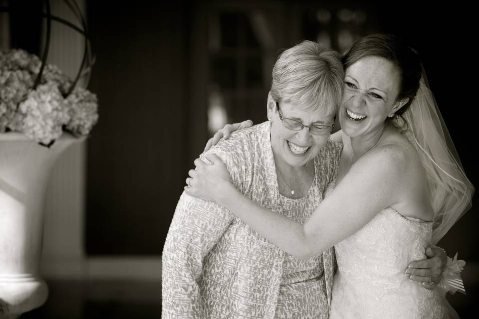 A bride hugs her grandmother who was also the officiant at her wedding in Dearborn, Michigan.