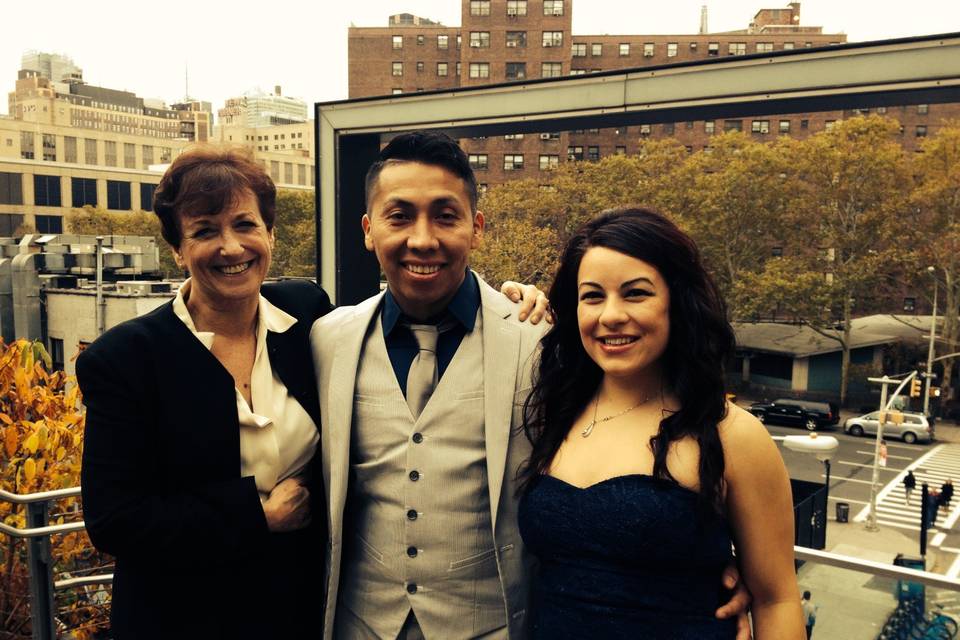 The reverend with the bride and groom