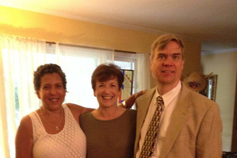 The reverend with the bride and groom