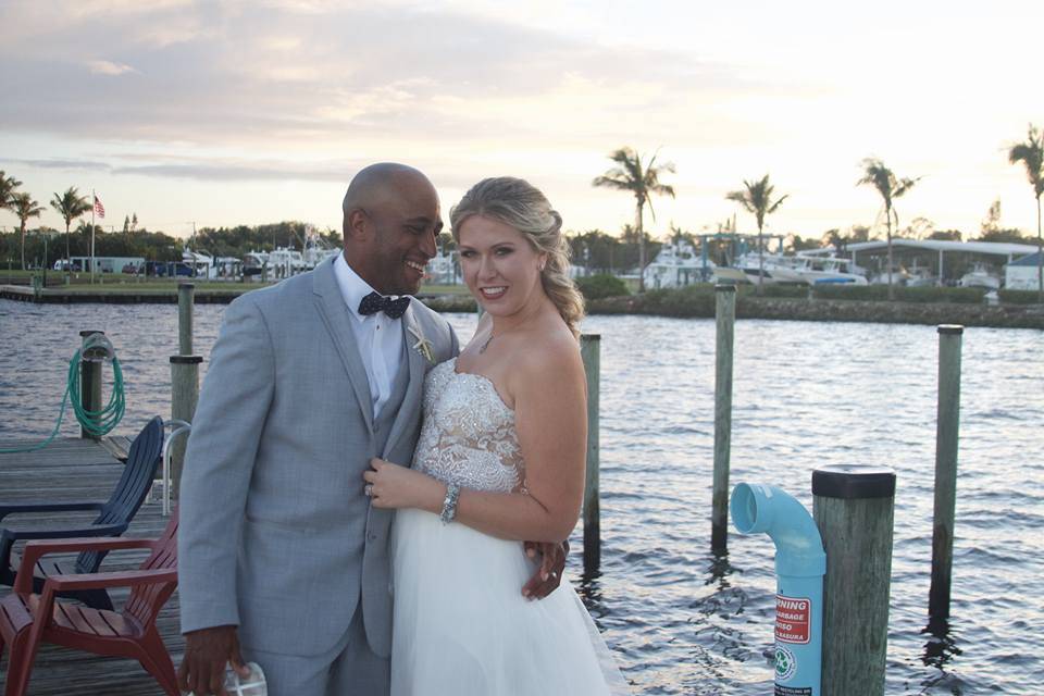 Happy bridal couple on a dock