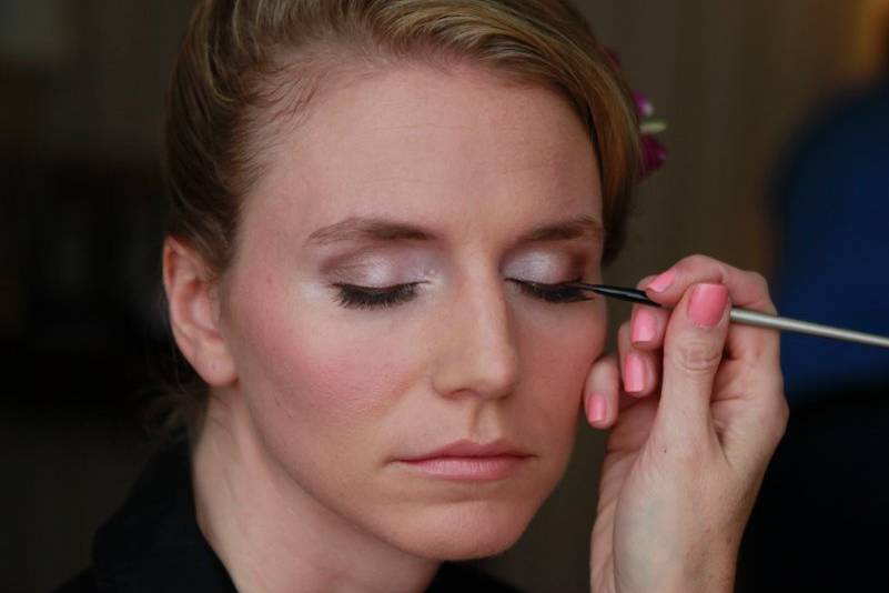 Putting on eye shadow