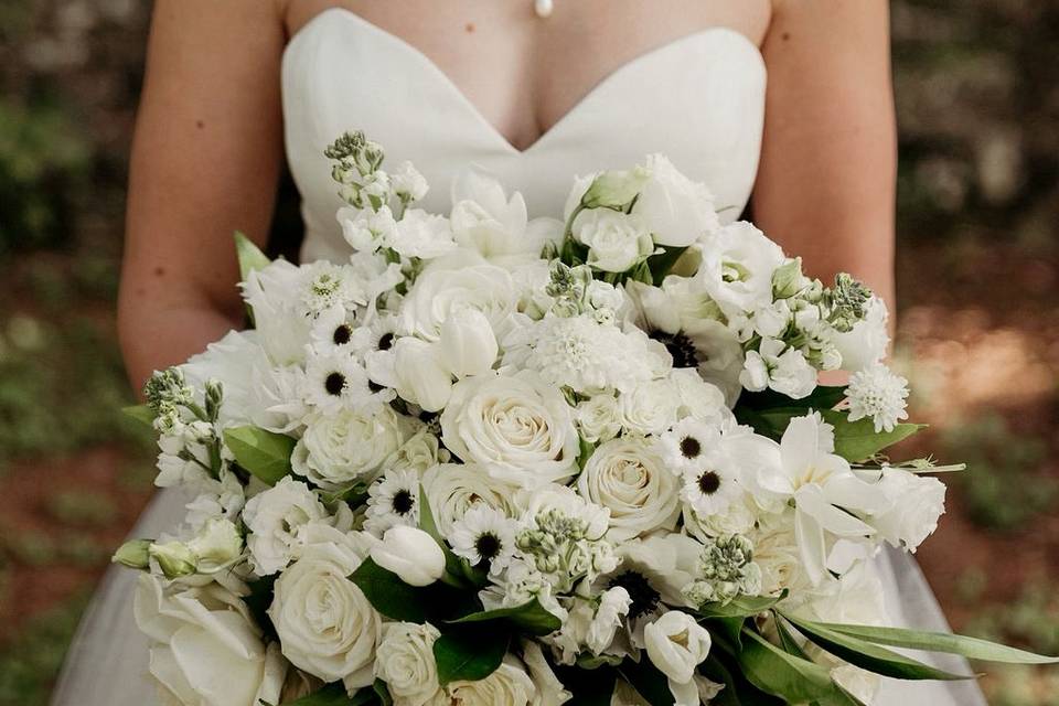 Blushing bride with bouquet