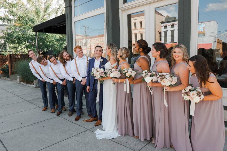 The wedding party looks on - Rose & Belle Photography