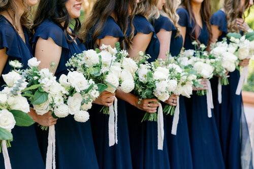 Wedding party with matching gowns and flowers