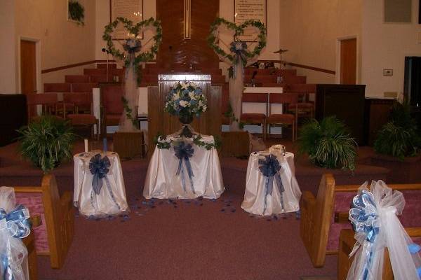 Alternative to using candles...We added beautiful tulle and ivy at the Brides request...there were 2 small tables set up....one was for the sand ceremony and the other was for the couple to take Holy Communion!